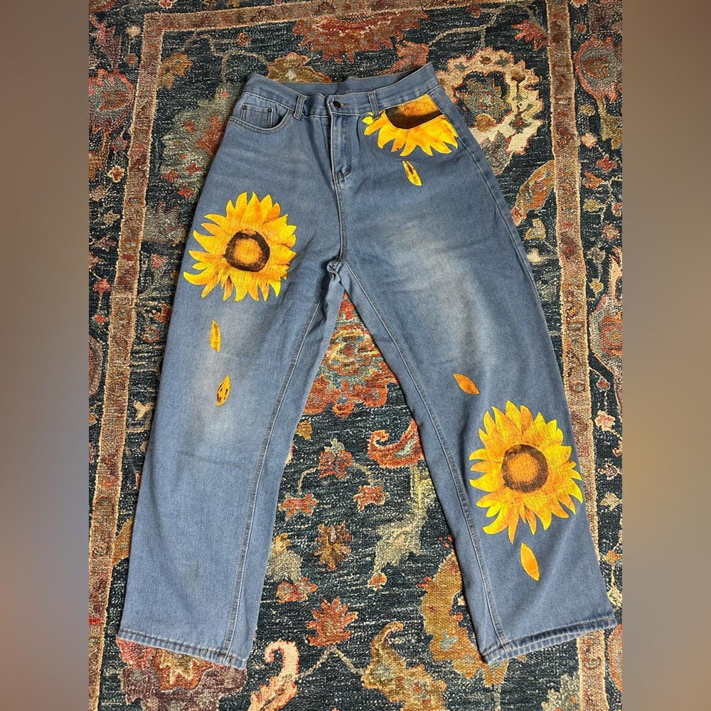 Women’s hand painted sunflower jeans. Size large.
